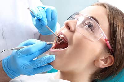 Girl getting a dental cleaning